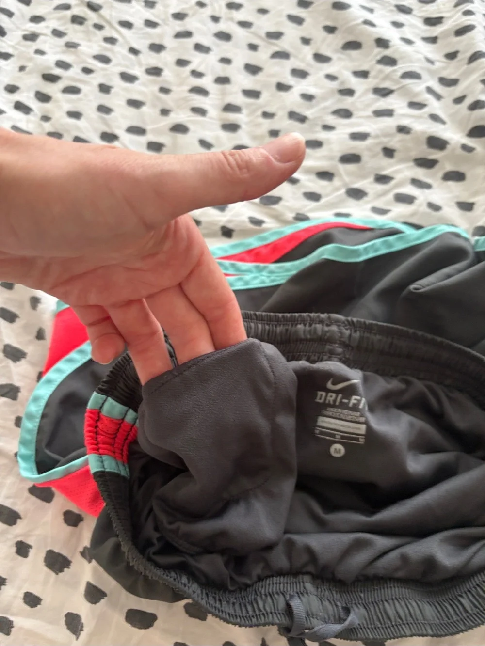 Nike Black Athletic Shorts with Teal Trim and Coral Side Panels